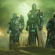 An image shows a trio of Destiny players standing together in front of green, ominous clouds.